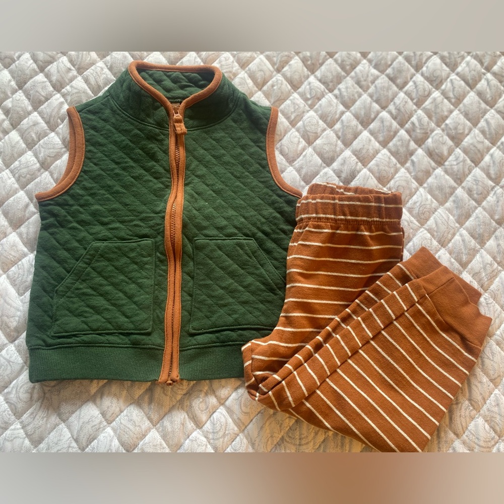 Carter's Green Quilted Vest with Brown and White striped pants.